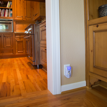 Pest Repeller Ultimate® AT plugged into an outlet near the kitchen